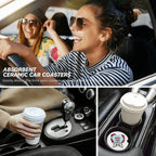 Two women in a car with a focus on absorbent ceramic car coasters.