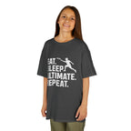 Child wearing a dark gray t-shirt with 'Eat. Sleep. Ultimate. Repeat.' text and graphic on a white background