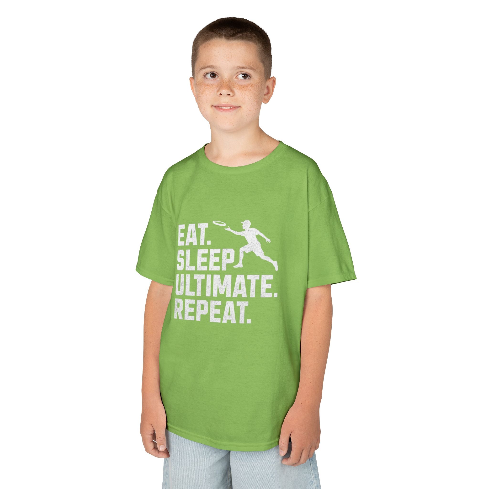 Child wearing a green t-shirt with 'Eat. Sleep. Ultimate. Repeat.' text and graphic on a white background