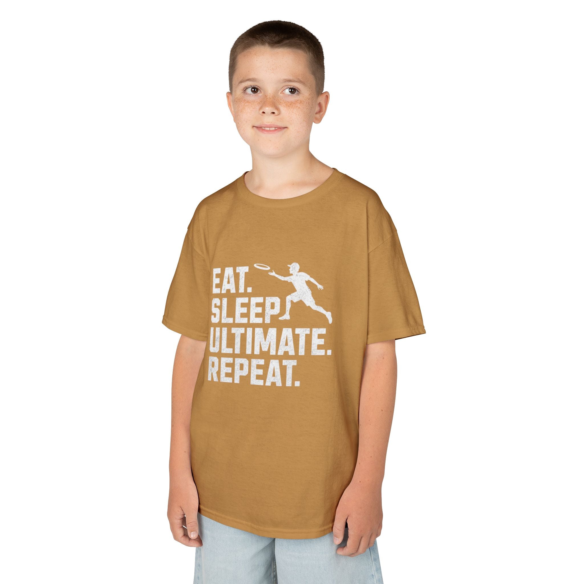 Child wearing a brown t-shirt with 'Eat. Sleep. Ultimate. Repeat.' text and graphic on a white background