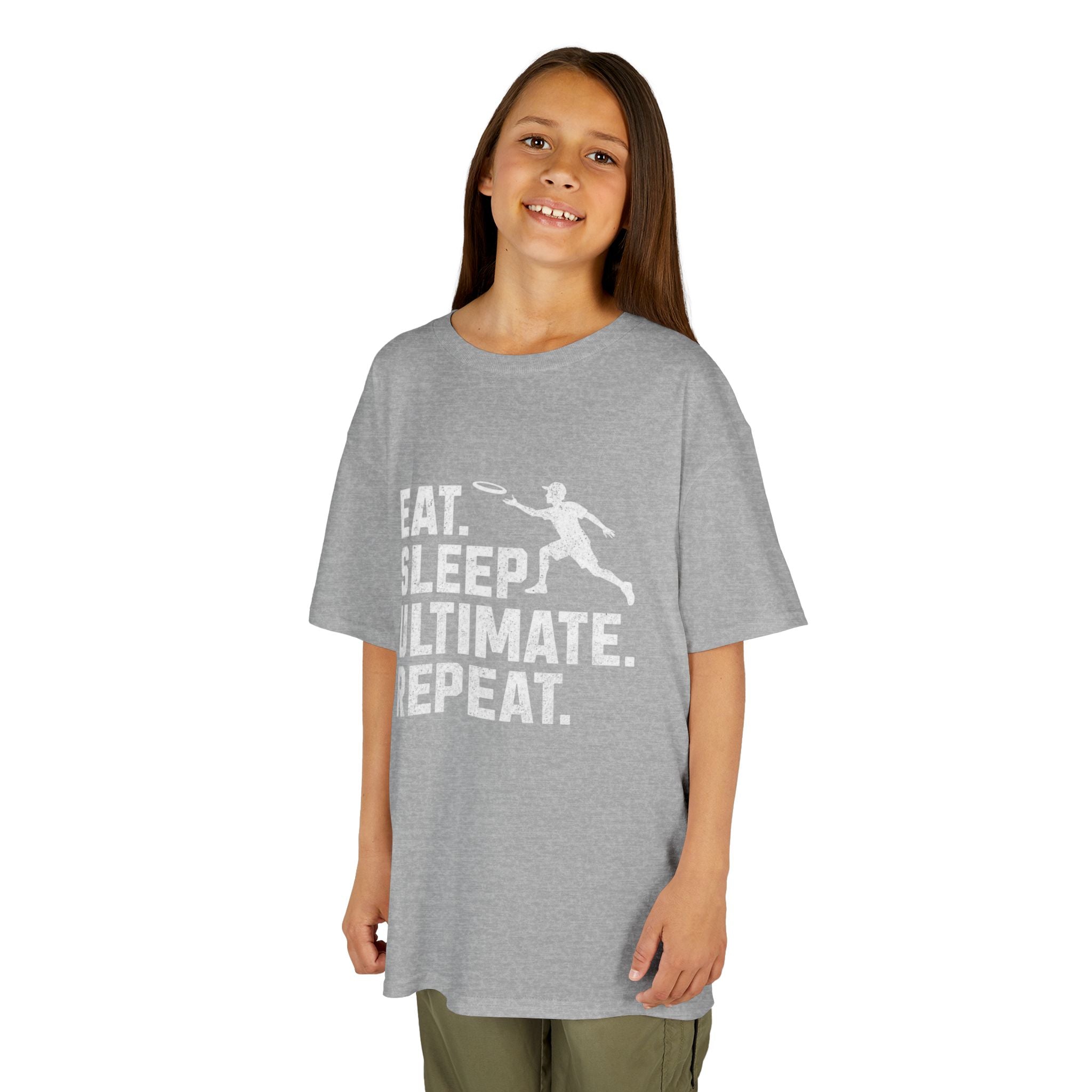 Girl wearing a gray t-shirt with 'Eat. Sleep. Ultimate. Repeat.' text and graphic on a white background