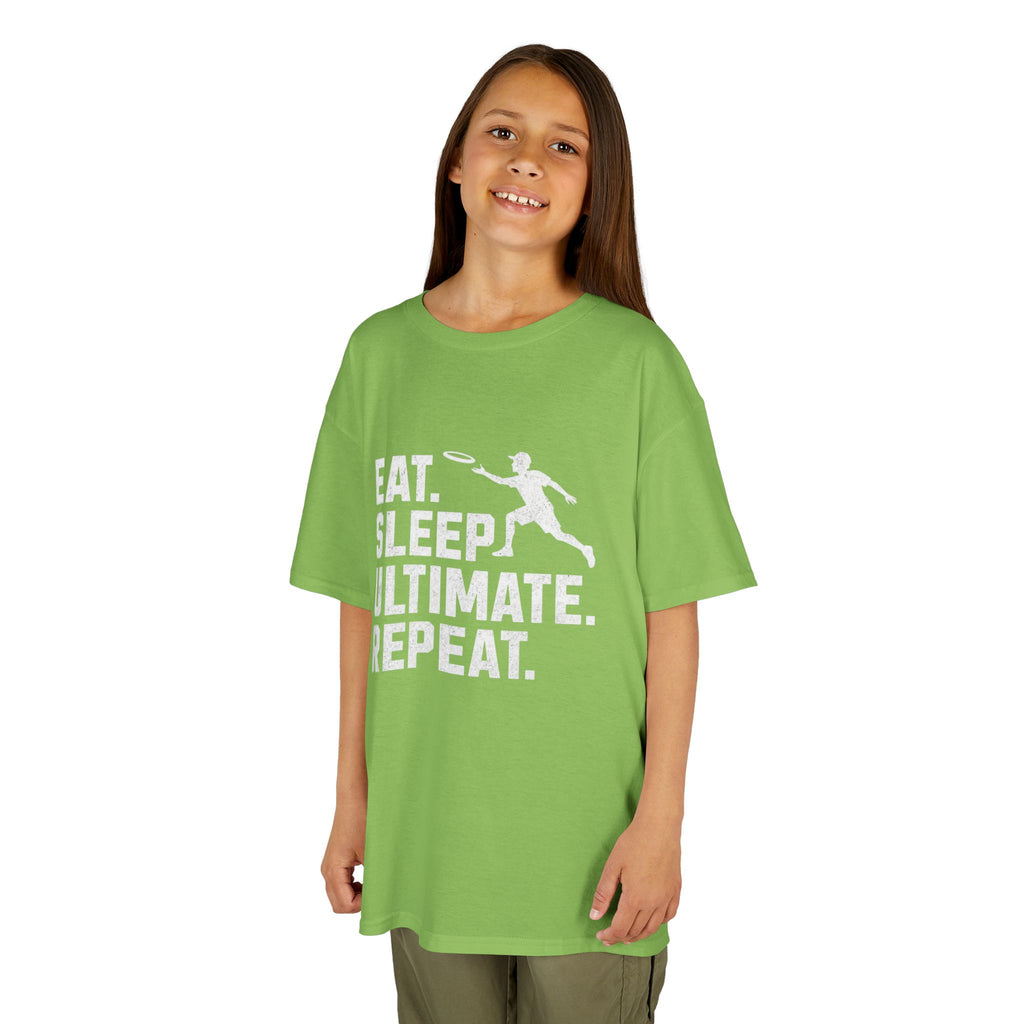 Child wearing a green t-shirt with 'Eat. Sleep. Ultimate. Repeat.' text and graphic on a white background