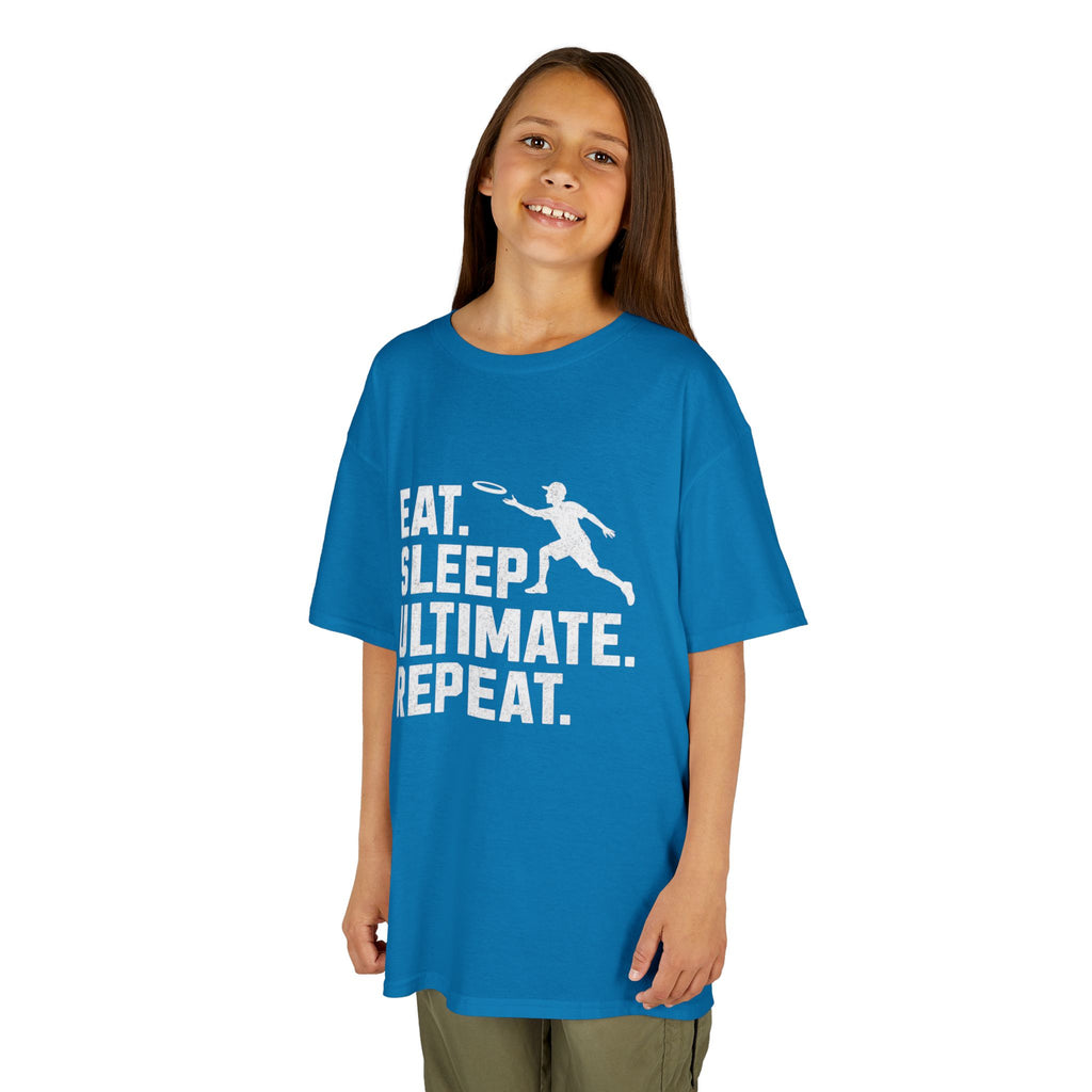 Child wearing a blue t-shirt with 'Eat. Sleep. Ultimate. Repeat.' text and graphic on a white background