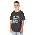 Child wearing a dark gray t-shirt with 'Eat. Sleep. Ultimate. Repeat.' text and graphic on a white background