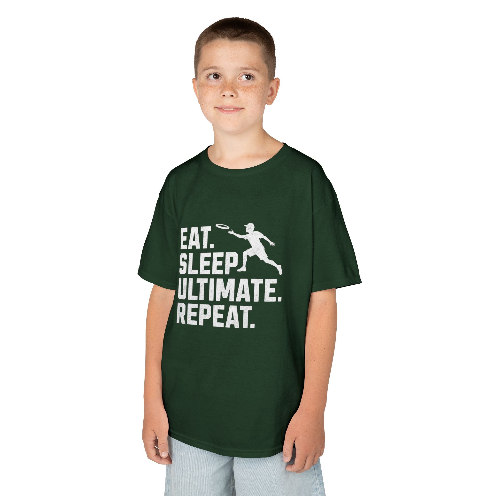 Child wearing a green t-shirt with 'Eat. Sleep. Ultimate. Repeat.' text and graphic on a white background