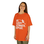 Child wearing an orange t-shirt with a white graphic and text on a white background