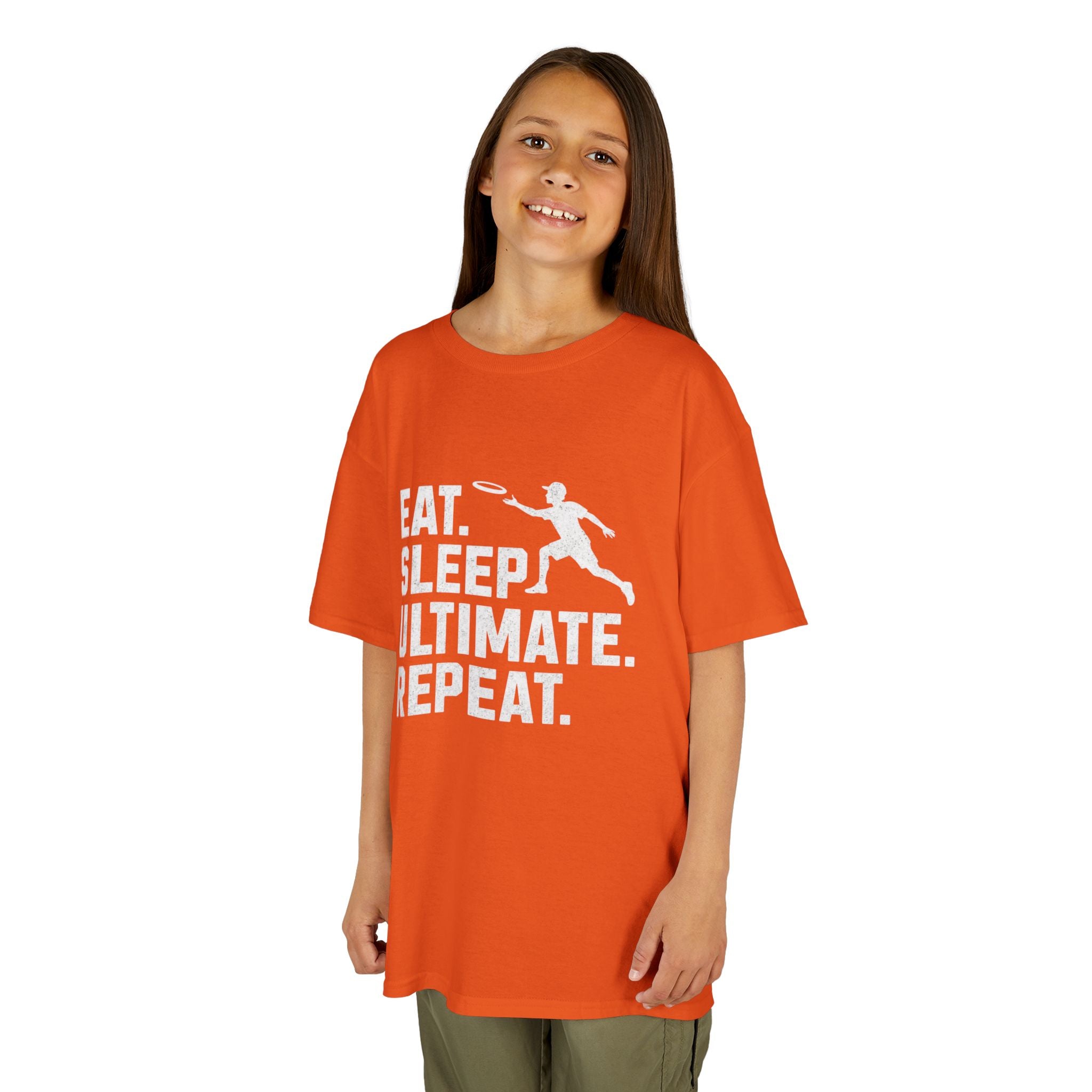 Child wearing an orange t-shirt with a white graphic and text on a white background