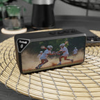 Bluetooth speaker with a colorful lacrosse design on a woven mat
