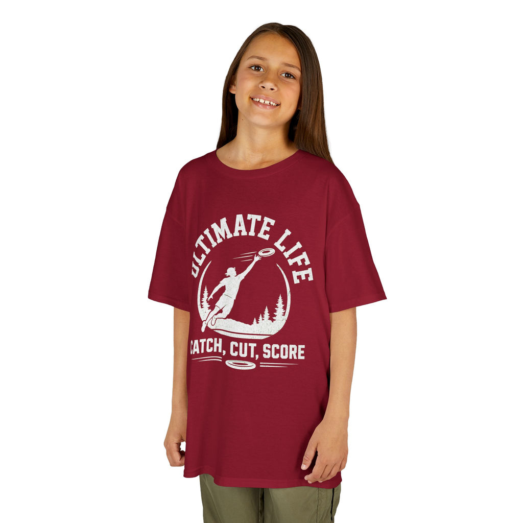 Child wearing a red t-shirt with a graphic design on a white background