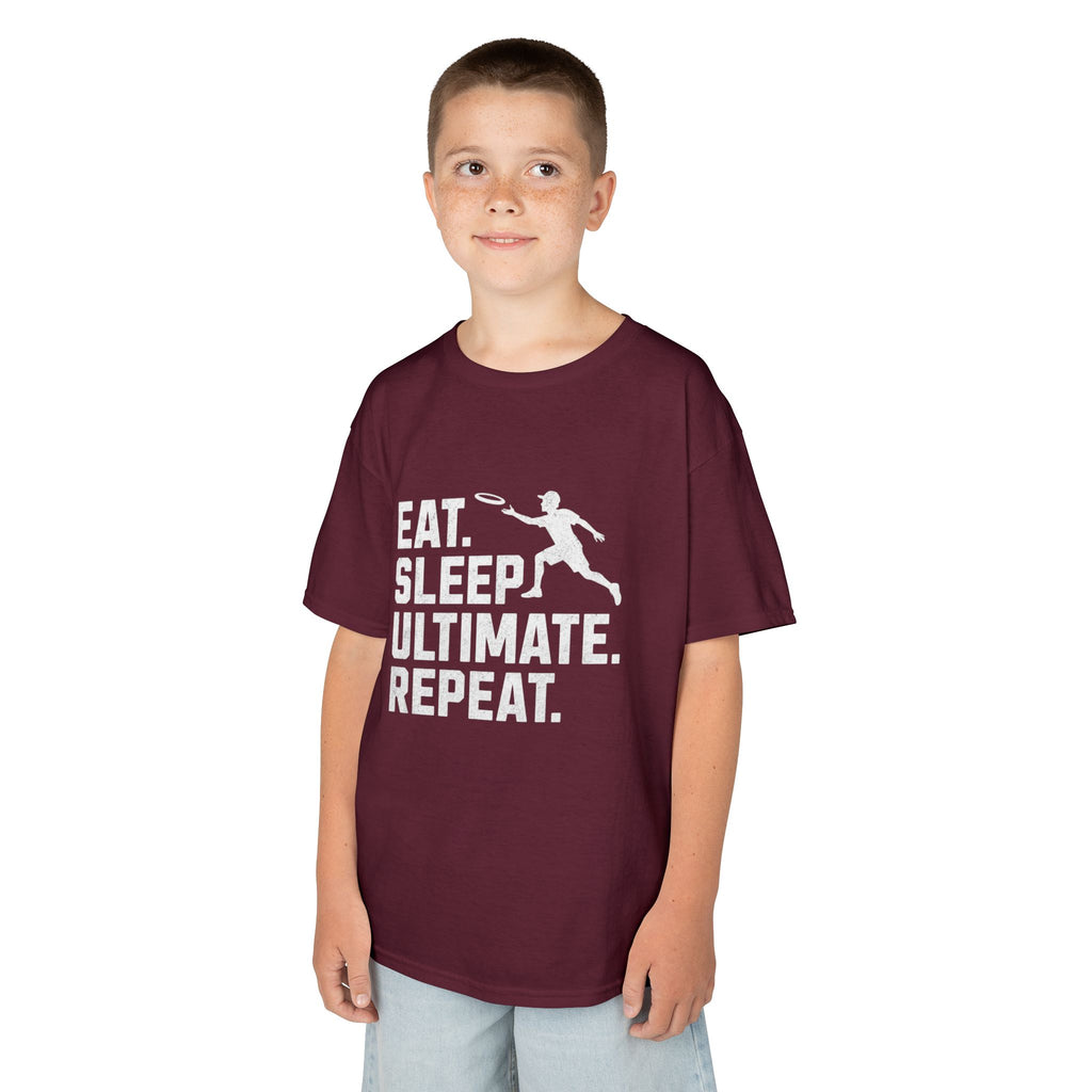 Child wearing a maroon t-shirt with 'Eat. Sleep. Ultimate. Repeat.' text and graphic on a white background