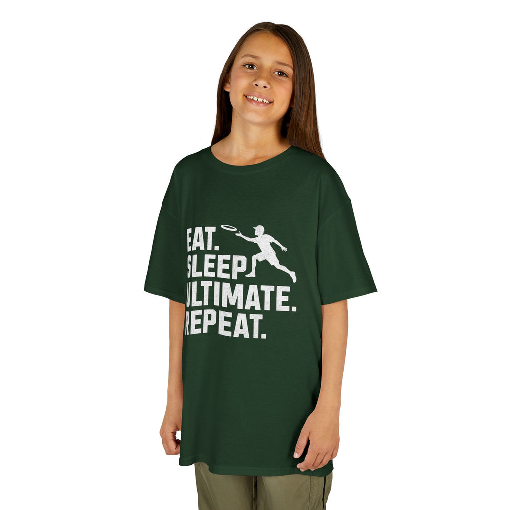 Child wearing a green t-shirt with 'Eat. Sleep. Ultimate. Repeat.' text and graphic on a white background