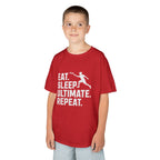 Child wearing a red t-shirt with 'Eat. Sleep. Ultimate. Repeat.' text and graphic on a white background