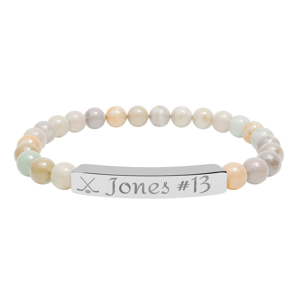 Beaded bracelet with a nameplate on a white background