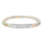 Beaded bracelet with a nameplate on a white background