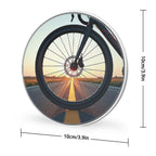 Bicycle wheel with a scenic road through spokes on a white background