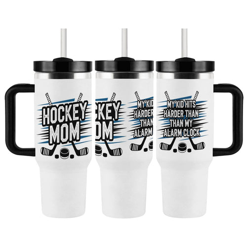 Three views of white tumbler with black handles and hockey-themed text that states "Hockey Mom" on front and "My Kid Hits Harder Than My Alarm Clock" on the back on a white background
