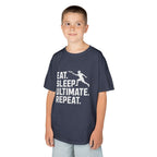 Child wearing a dark gray t-shirt with 'Eat. Sleep. Ultimate. Repeat.' text and graphic on a white background