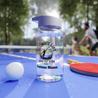 personalized clear water bottle with ultimate frisbee design on a ping pong table outdoors