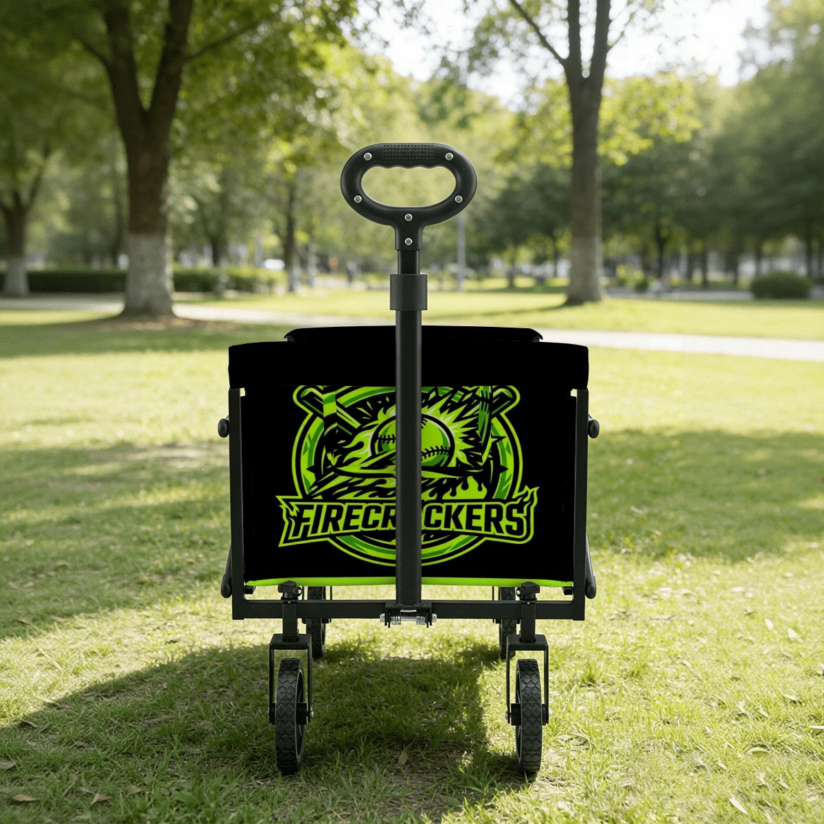 Black and green cart with a logo on a grassy area