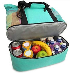 Open teal cooler bag with food and drinks on a white background
