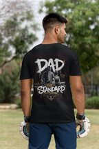 Man wearing a black t-shirt with 'DAD THE STANDARD' male gymnast design outdoors
