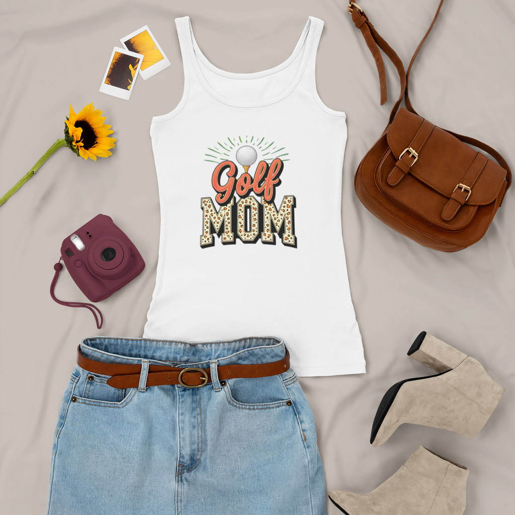 White tank top with 'Golf Mom' text, denim skirt, brown purse, sunflower, camera, and shoes on a light gray background