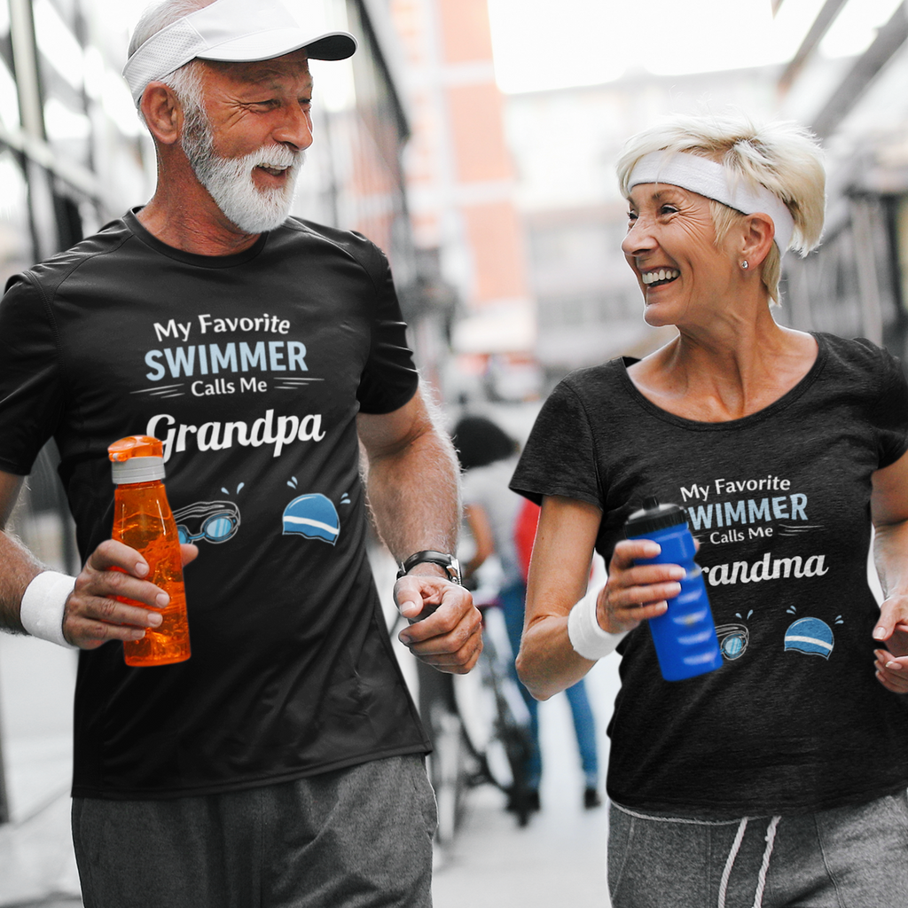 Man and woman running together wearing matching t-shirts with 'My Favorite Swimmer Calls Me Grandpa' and 'My Favorite Swimmer Calls Me Grandma'.