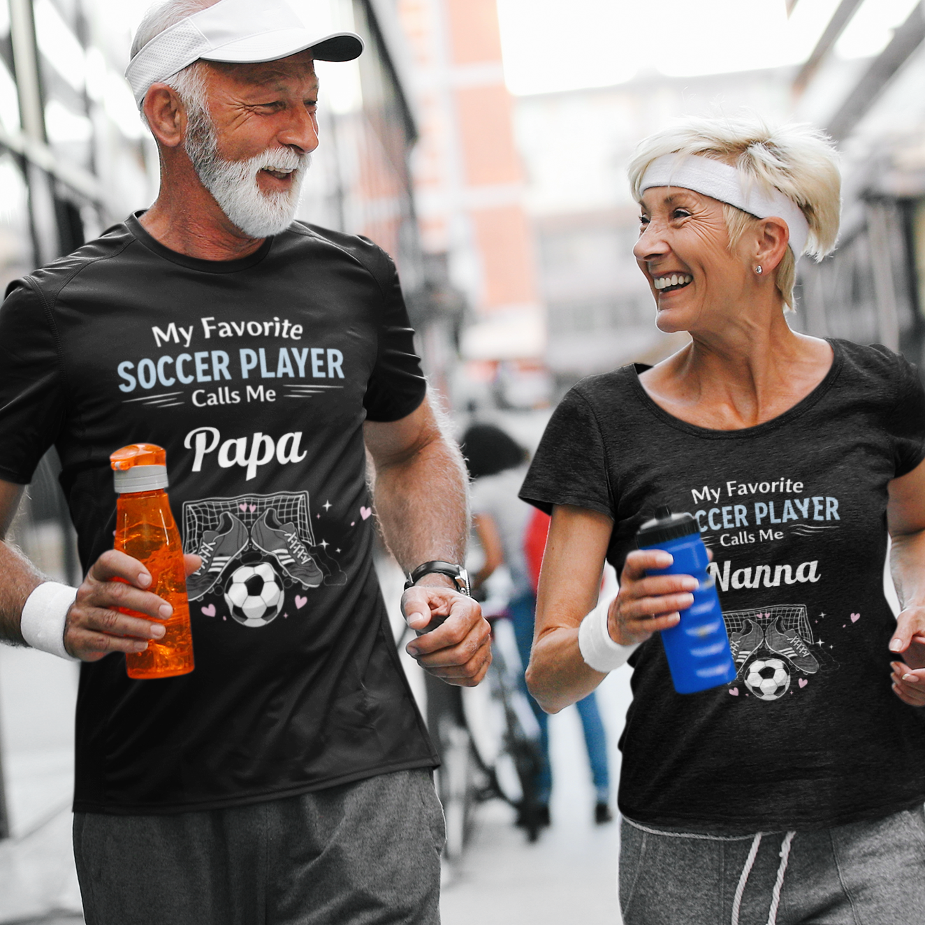 Two people running outdoors wearing matching t-shirts with soccer-themed text.