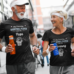 Man and woman walking together wearing matching t-shirts with humorous text about basketball and family.