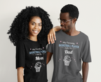 Two people wearing matching t-shirts with text about a swimmer and dad.