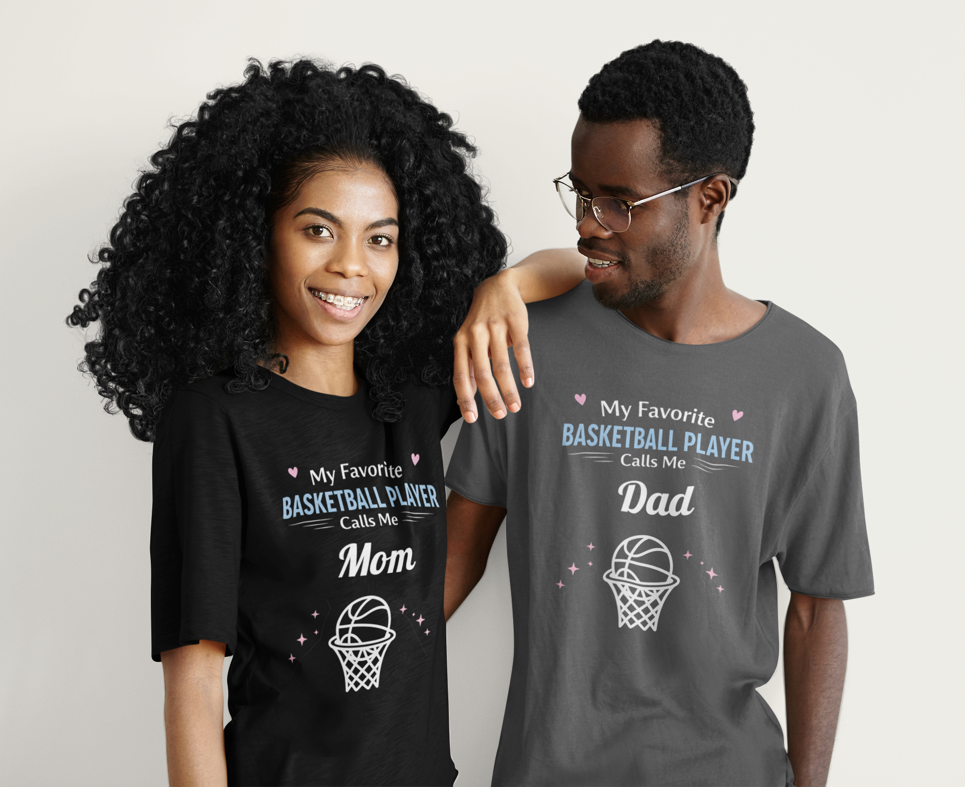 Two people wearing matching t-shirts with text about a swimmer and dad.
